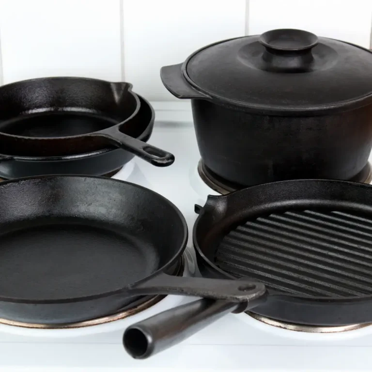 A seasoned cast iron skillet filled with sizzling vegetables, placed on a rustic wooden table with cooking utensils nearby.