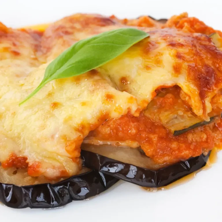 Eggplant Parmesan Recipe: A hearty dish with layers of breaded eggplant, marinara sauce and melted mozzarella cheese, baked to perfection.