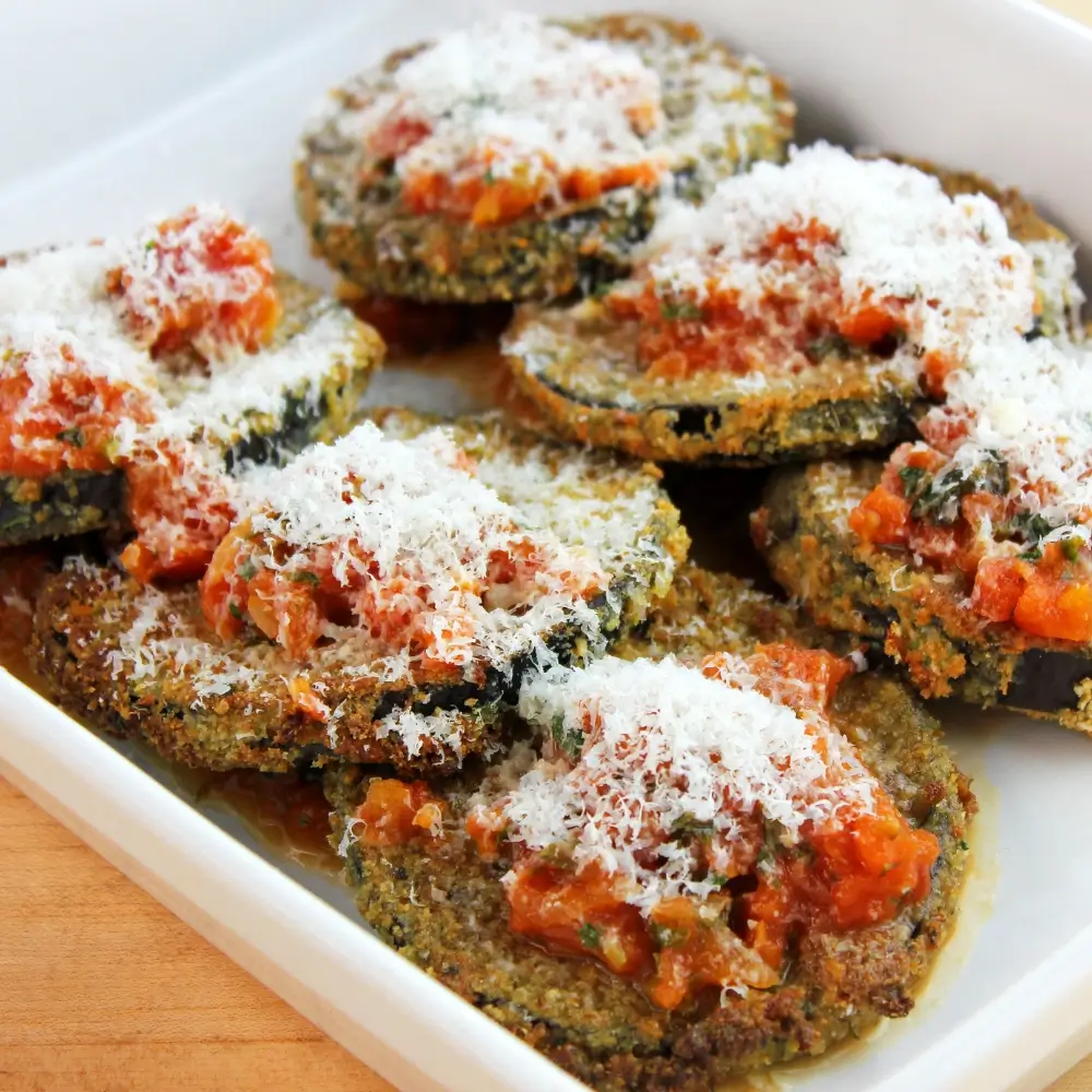 Eggplant Parmesan Recipe: A hearty dish with layers of breaded eggplant, marinara sauce and melted mozzarella cheese, baked to perfection.