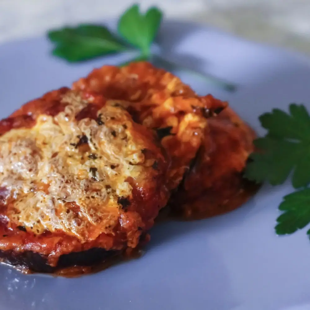 Eggplant Parmesan Recipe: A hearty dish with layers of breaded eggplant, marinara sauce and melted mozzarella cheese, baked to perfection.