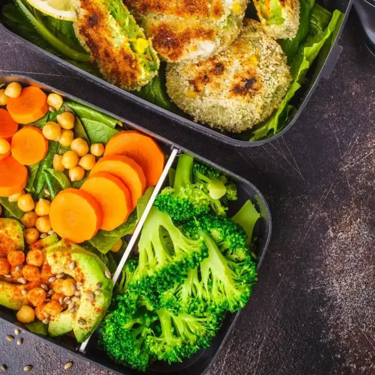 A selection of colorful vegetarian meal prep dishes, featuring fresh vegetables, grains, and plant-based proteins in neat containers.