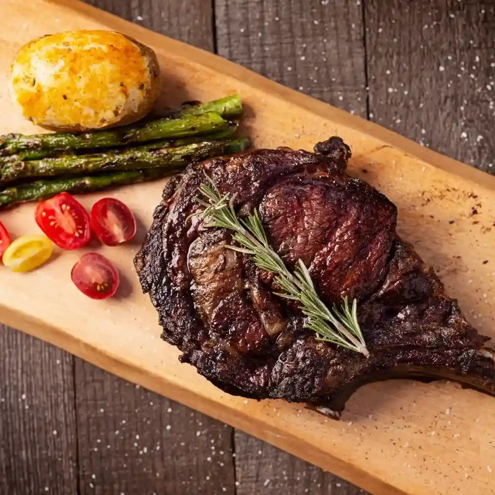 Juicy Tomahawk Steak Recipe grilled to perfection with a rich sear.